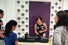 Fellow instructor Jacelyn runs through some voice exercises